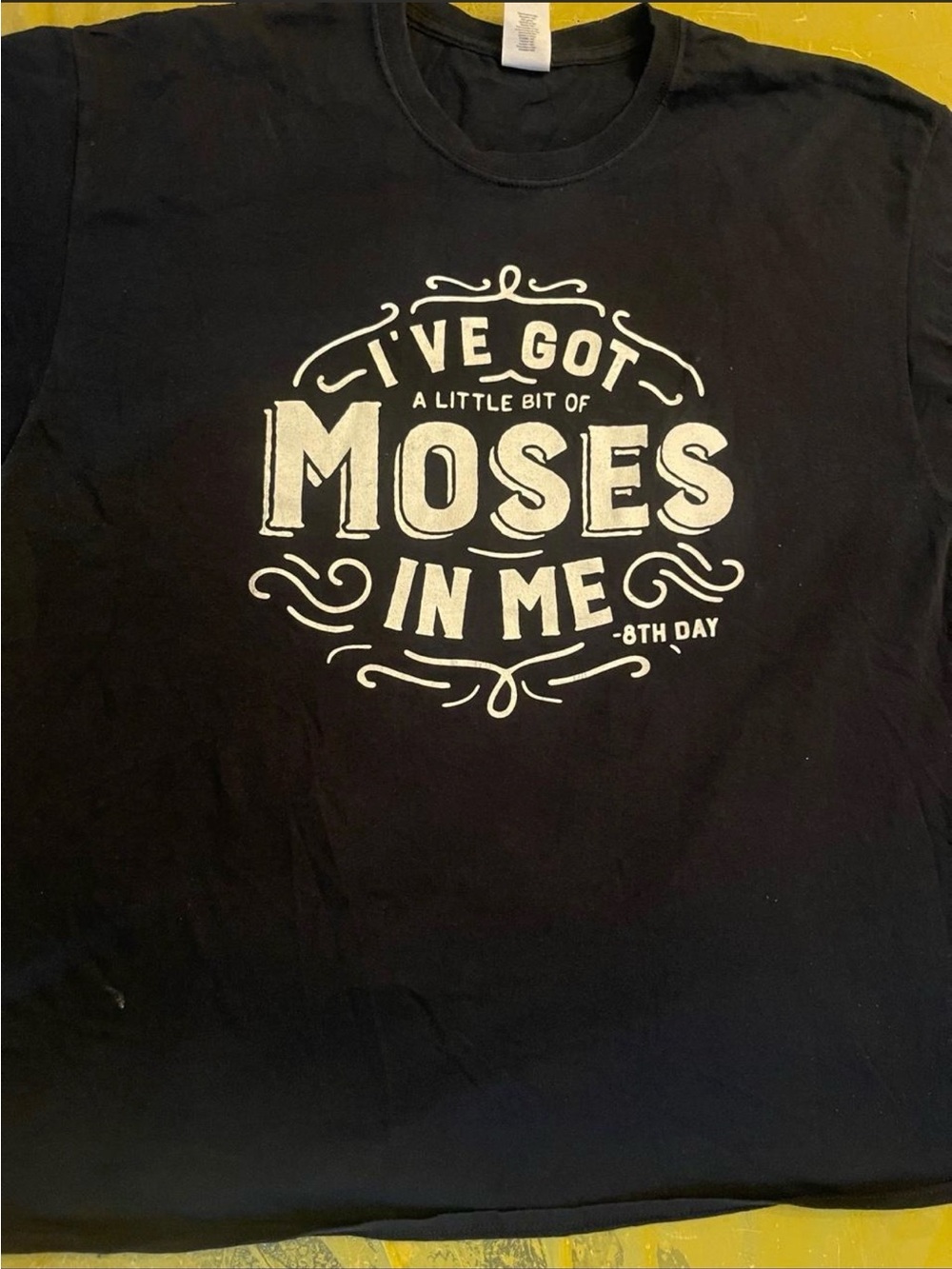 Black Gildan heavy cotton t-shirt with white text reading 'I'VE GOT A LITTLE BIT